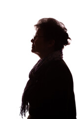 Dark silhouette of an elderly woman, pensioner in glasses - isolate