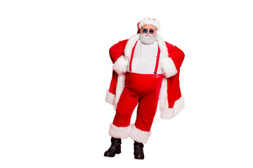 Full length photo of strict santa claus bad guy fat overweight with big belly decide choose naughty kids have stylish eyewear hat standing isolated over red background