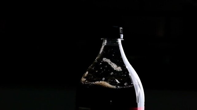 Shaking A Bottle Of Cola Causes Drops And Splashes The Bottle
