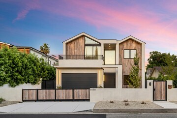 Fototapeta premium Modern house with wooden accents at sunset.