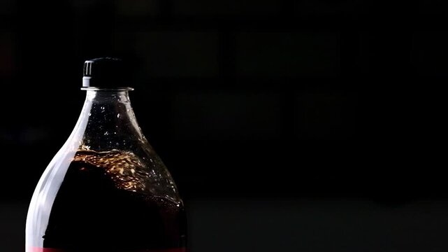 Shaking Bottle Of Cola Causes Drops And Splashes The Bottle