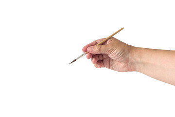 Hand holding a painting brush, close-up on a light background, isolate