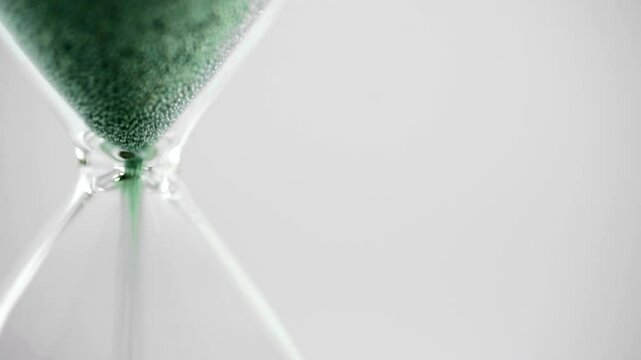 Close-Up Sand Timer with Green Sand Representing Climate Action and Sustainability, Climate Clock