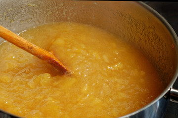 Boiled apples in cooking pot preparing preparing