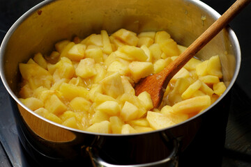 Apples in cooking pot preparing preparing