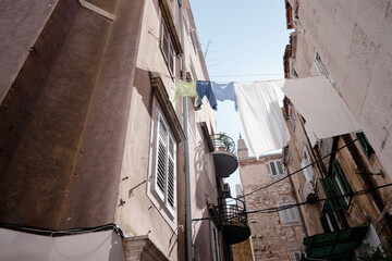 Obraz premium Travel by Split in Croatia. Ancient architecture of old town. Drying clothes.