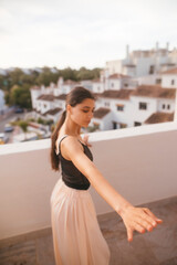 An Elegant Dance Pose Captured Beautifully in a Scenic Balcony Setting Surrounded by Nature