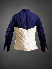 Historical fashion. Medieval knight cloth. Padded jacket gambeson.
