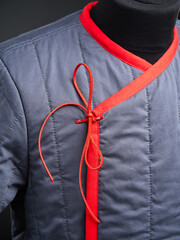 Historical fashion. Medieval knight cloth. Padded jacket gambeson.