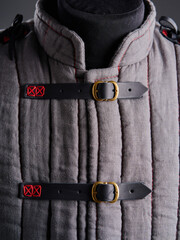 Historical fashion. Medieval knight cloth. Padded jacket gambeson.