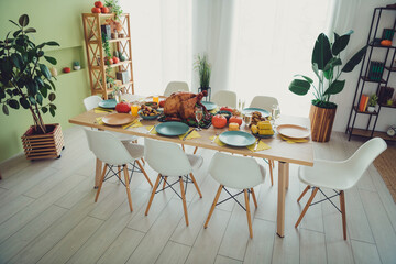 Photo of tasty meal roasted turkey big family thanksgiving day celebration indoors room home