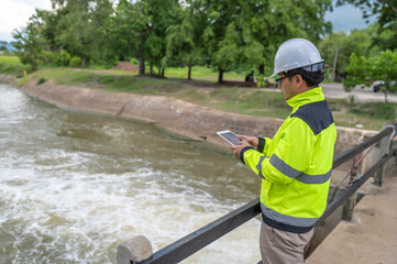 A engineering doing his checking routine. He is wearing hard hat and engineer uniform.Standing by...