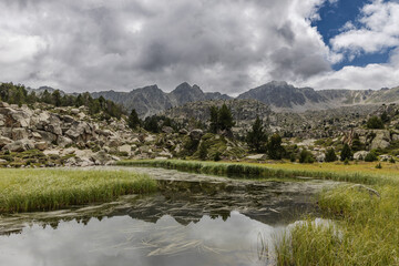 Estany del Cap dels Pessons, lake de Pessons in the Pyrenees mountains of Andorra, summertime