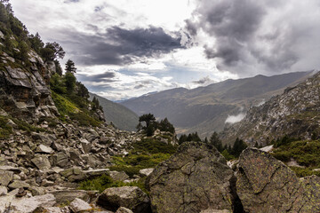 Vall d'incles, valley in the mountains after the rain, stormy clouds