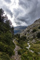 Vall d'incles, valley in the mountains after the rain, stormy clouds