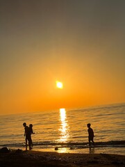 Fototapeta premium A Great View the Sunset beach and Children Are Playing Joyfully