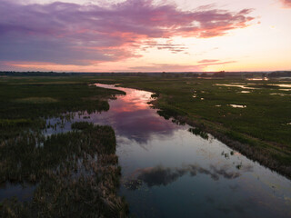 Aerial panoramic sunset sunrise scene at swamps and wetlands of Big Creek National Wildlife Area near Long Point Provincial Park, Lake Erie shore.