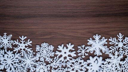 Delicate white snowflakes dance across a rustic wood grain backdrop adorned with pine cones and winter magic