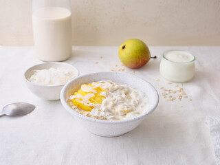 Overnight oats with mango and coconut topping. Fitness healthy breakfast in a bowl