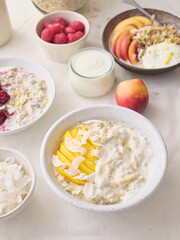 Overnight oats with various toppings. Fitness healthy organic breakfast in a bowl