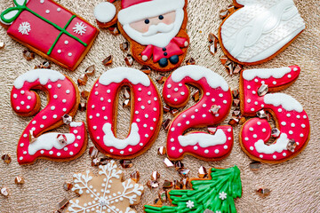 Christmas and New Year banner gingerbread cookies numbers 2025 on golden background