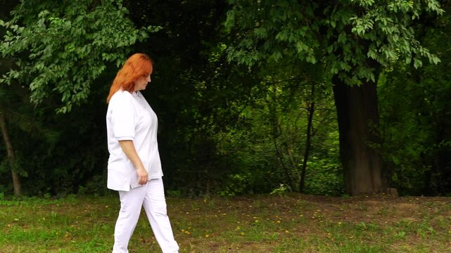 Senior woman walks relaxing outdoor on nature