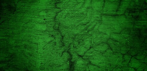 Fototapeta premium the long wall background is green, blank uncoated canvas or scrim for background long and wide panoramic banner background from rough linen dark green cloth or burlap