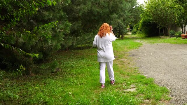 Senior woman walks relaxing outdoor on nature