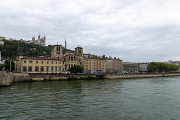 Lyon with a view over the Saone to the church Notre Dame in rainy weather in spring