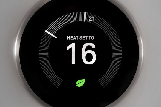 Smart Thermostat with Heat Set to Low 16 Celsius Close Up Cropped Shot