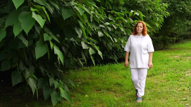 Senior woman walks relaxing outdoor on nature