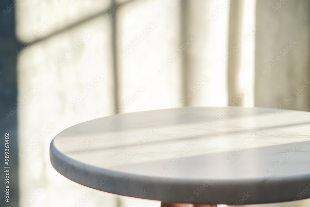 Poster Minimalist Gray Marble Table Surface with Sunlit Blurred Background - Ideal for Product Display in Stock