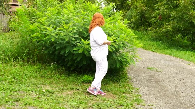 Senior woman walks relaxing outdoor on nature