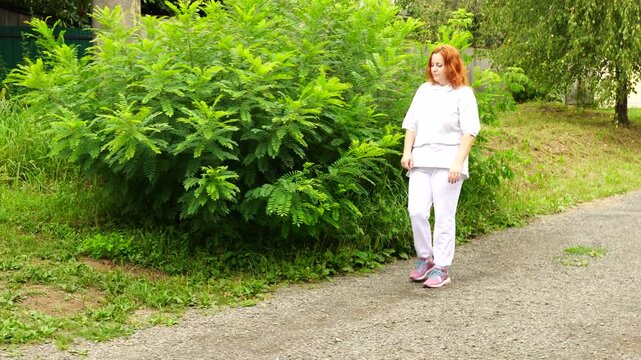 Senior woman walks relaxing outdoor on nature