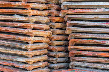 A stack of clay roof tiles