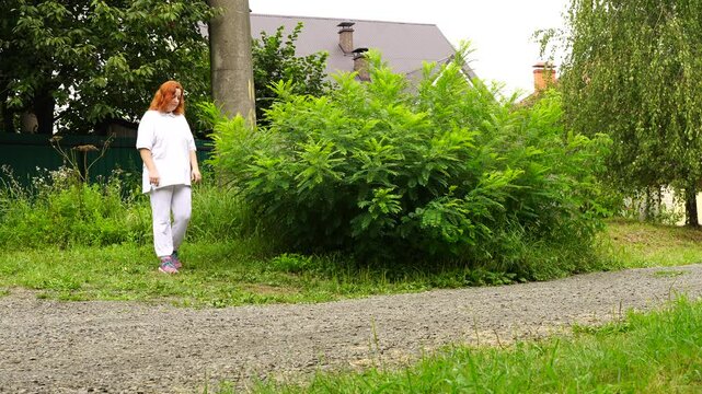 Senior woman walks relaxing outdoor on nature