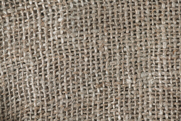 Close up background, natural craft brown linen fabric, thread weave, textile texture, perfect for backgrounds, textiles, wallpapers