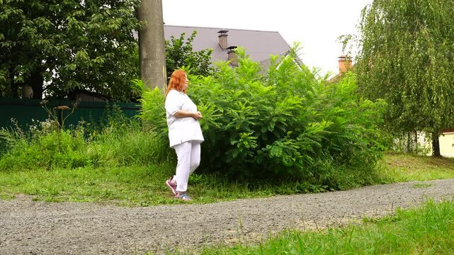 Senior woman walks relaxing outdoor on nature