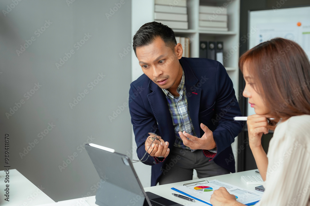 Poster businessman explaining and having disagreement with his colleague while working on a project in the 
