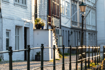Sunset on a street with old, decorated facades; the magic of twilight between soft lights and shadows.
