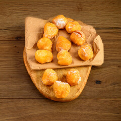 Fritters on Paper and Aged Wooden Board