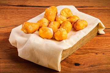 Box of Fritters on Dark Wooden Surface