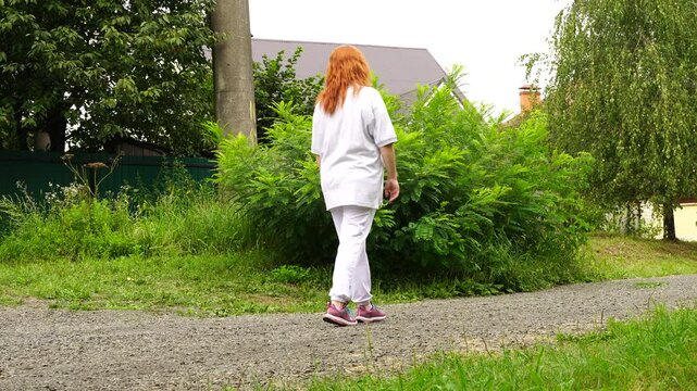 Senior woman walks relaxing outdoor on nature