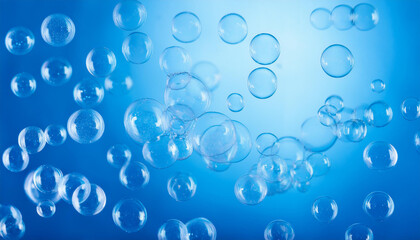 Shimmering soap bubbles on vibrant blue background. Glowing shades and fluid patterns. Close-up.