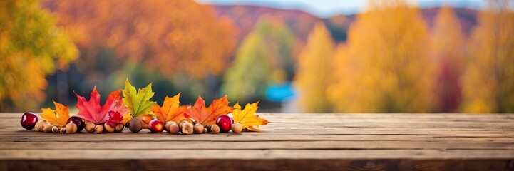 Obraz premium Wooden empty table for demonstration and montage of product with yellow orange autumn decor made of fallen leaves and bright trees. Autumn mood, harvest, school, Halloween. Copy space