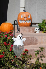 Halloween ghost and pumpkin decorations infront of the house