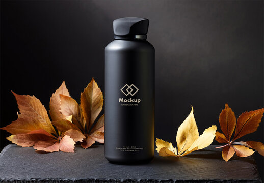 Black Stainless Steel Water Bottle Mockup on a Slate Desk Dark studio backdrop with Autumn Dry Leafs AI Generated