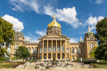The Iowa state Capitol building on a hot late summer day with blue skies and clouds.  Des Moines,...