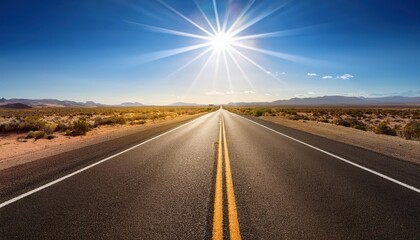 Fototapeta premium A long, straight road stretches towards a bright sun.