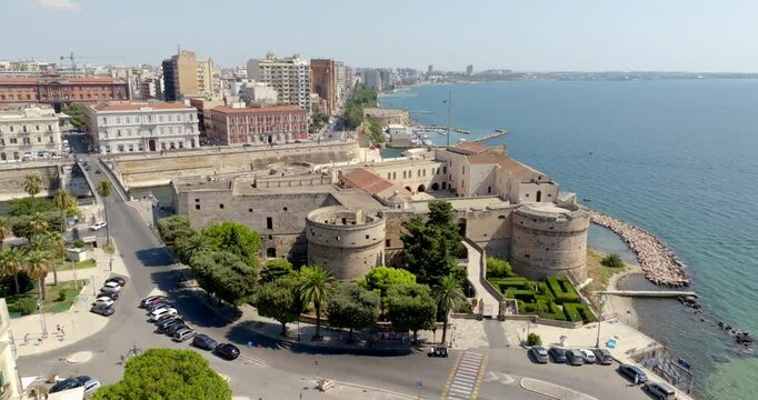 Aerial view of the Aragonese castle, officially called Castel San Angelo, in the historic center of Taranto, Puglia, Italy. It has a quadrangular plan and a large central courtyard.